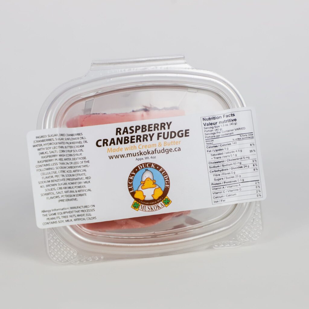 A plastic container of Lucky Duck Fudge's Raspberry Cranberry fudge flavour, photographed on a white background.